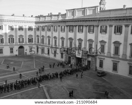 MILAN, ITALY - FEBRUARY 23, 2014: People queueing in front of Palazzo Reale exhibition room to visit a temporary exhibition
