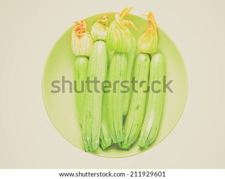 Vintage retro looking Detail of courgettes or zucchini vegetable food - isolated over white background