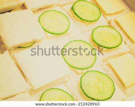 Vintage retro looking Traditional British cucumber sandwich with butter and bread