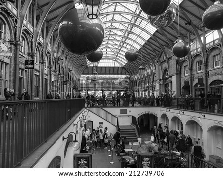 LONDON, ENGLAND, UK - OCTOBER 23: Tourists visiting the world famous Covent Garden on October 23, 2013 in London, England, UK