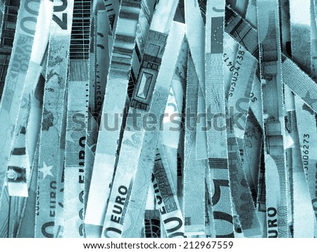 Money to burn - banknotes cut with a paper shredder - cool cyanotype