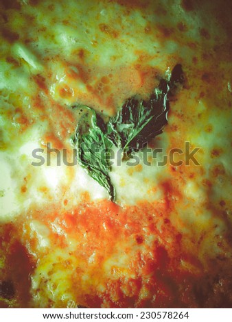 Vintage looking Detail of Italian Pizza Margherita background
