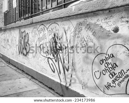 LONDON, ENGLAND, UK - JUNE 18, 2011: Graffiti by Beatles fans on the wall of the Abbey Road studios where the homonymous album was recorded in 1969