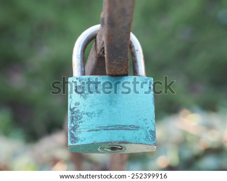 Love lock padlock sweethearts locked to a fence to symbolize eternal love
