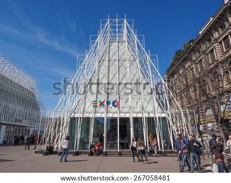 MILAN, ITALY - MARCH 28, 2015: Tourists in front of the Expo Gate information centre in Milan as part of the Expo Milano 2015 international exhibition