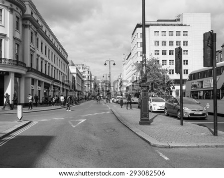 LONDON, UK - JUNE 09, 2015: Tourists in busy central London street in black and white