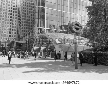 LONDON, UK - JUNE 10, 2015: Travellers at Canary Wharf underground station in black and white