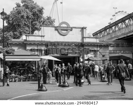 LONDON, UK - JUNE 09, 2015: Travellers at Embankment underground station in black and white
