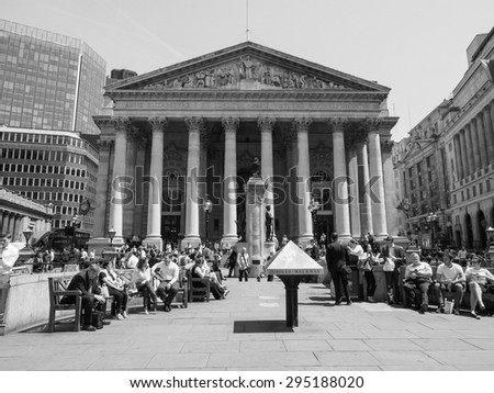 LONDON, UK - JUNE 11, 2015: People in front of The Royal Stock Exchange in black and white