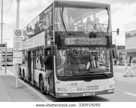 BERLIN, GERMANY - MAY 10, 2014: Tourists on BGV Bus for public transport in black and white