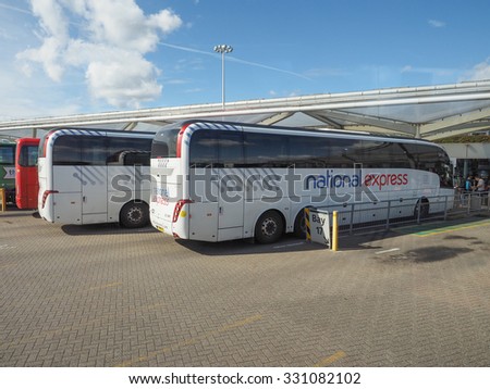 STANSTED, UK - SEPTEMBER 24, 2015: Travellers waiting for tranport at London Stansted airport coach station