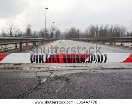 Local Police line (Polizia Municipale in Italian), do not cross. Bridge access blocked for flood risk