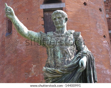 Roman statue of Caesar Augustus in front of roman walls