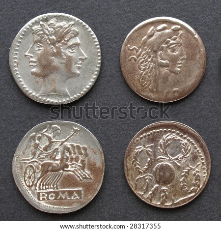 Ancient Roman coins on a black background