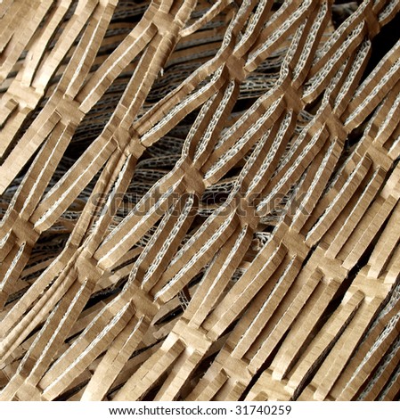 Ecological insulation material for packet packaging made of recycled corrugated cardboard