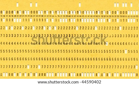 Vintage punched card for computer data storage isolated over white - (16:9 ratio)