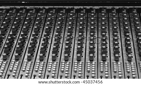 Detail of a mobile soundboard mixer for live music - (16:9 black and white)