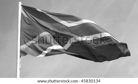 Flag of South Africa over a blue sky - (16:9 black and white)