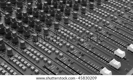Detail of a mobile soundboard mixer for live music - (16:9 black and white)