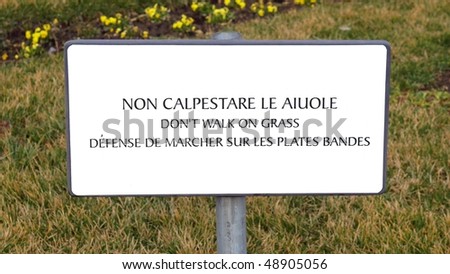 Multilingual don\'t walk on the grass sign