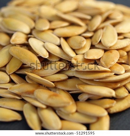 A heap of brown yellow melon seeds