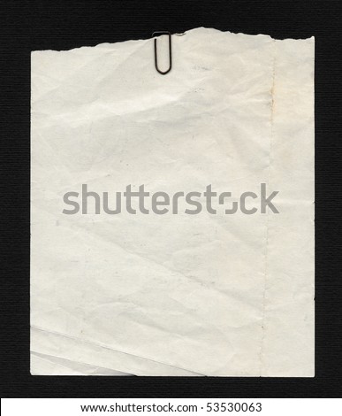 Blank paper page of a note pad - over black background
