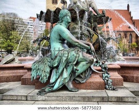 Neptunbrunnen (Neptune fountain) in Alexanderplatz square, Berlin, Germany - high dynamic range HDR