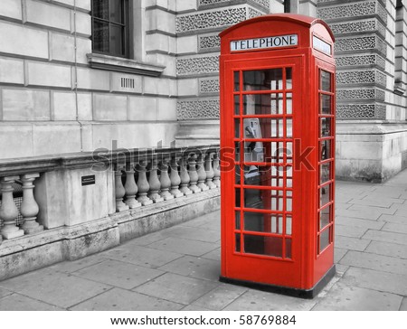 Traditional red telephone box in London, UK - high dynamic range HDR