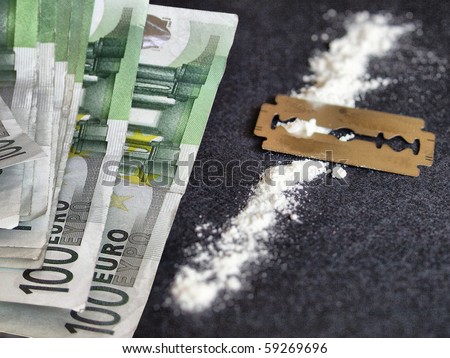 Cocaine and money - Note: simulated with wheat flour, no actual drug used