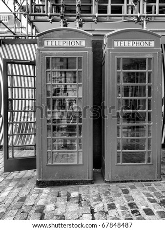 Traditional red telephone box in London, UK - high dynamic range HDR - black and white