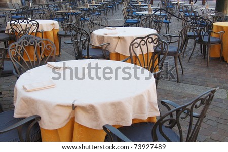 Tables and chairs of a dehors alfresco bar restaurant pub
