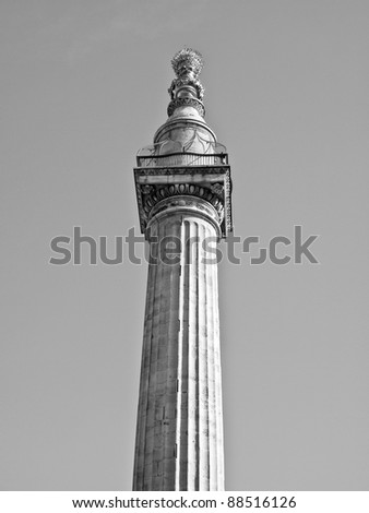 The Monument to commemorate the Great Fire of London in 1666 - over blue sky background