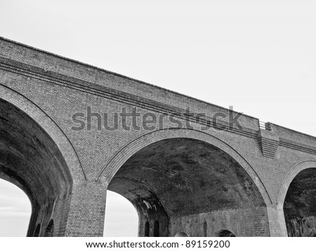 Old train bridge made of red bricks masonry