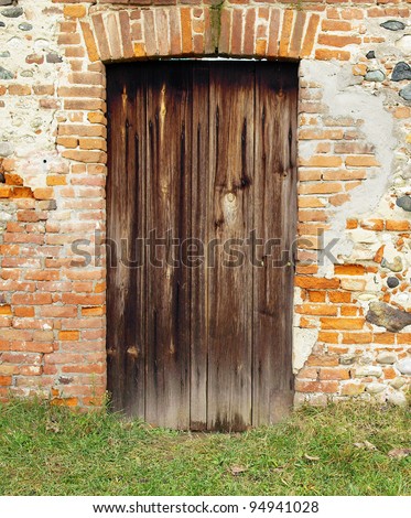 An old wooden door in a wall