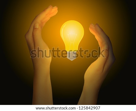Woman hand holding a light bulb.