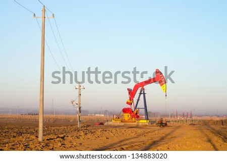 Oil and gas industry. Work of oil pump jack on a oil field. Extraction of oil. Oil industry of West Siberia