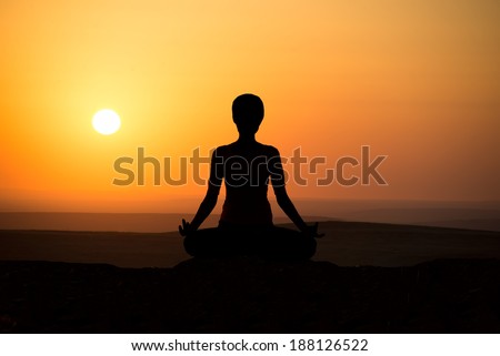 Girl practicing yoga at sunrise, outdoor sun
