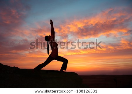 Girl practicing yoga at sunrise, outdoor sun