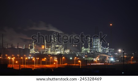 Oil and gas industry refinery factory petrochemical plant lit up at night