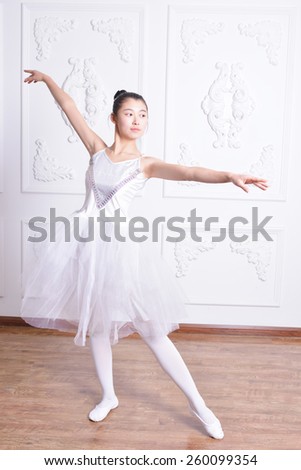Beautiful female ballet dancer dress rehearsals in the Studio