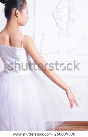 Beautiful ballerina dress rehearsal, elegant back posture