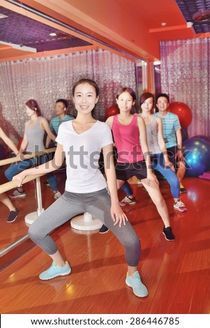 Contact Yoga warm up exercises. Four young Asian characters