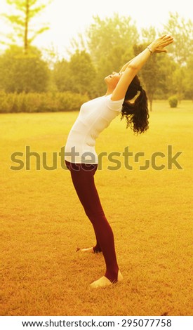 Elderly woman practicing yoga. At Park Lawn