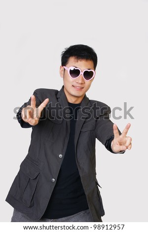 Chinese boy making the victory sign.