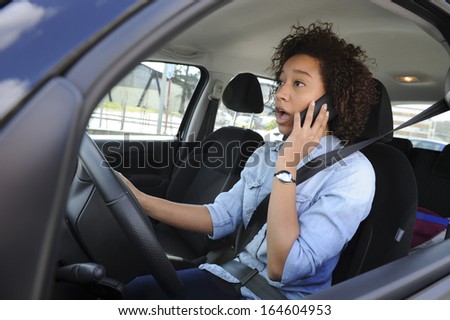 Phone while driving-car-Woman-Traffic-Violation