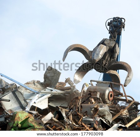 Scrap metal recycling plant and crane-Loading scrap in a truck