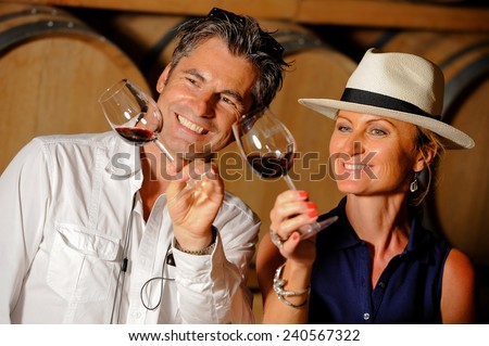 Tourism - Couple tasting wine in a cellar
