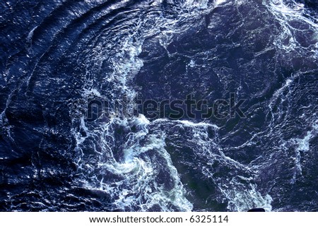 Churning water in the Caribbean ocean behind a cruise ship off the coast of Grand Cayman - see more in portfolio