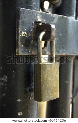 Close-up of Lock on old rusty gate