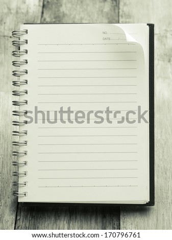 Paper page notebook. textured isolated on the wood backgrounds